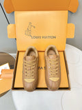 Tan lace-up low-top sneakers with LV logo on side, shown as a pair