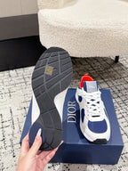 Unisex sneaker outsole and heel view: dark tread with white-and-navy upper, Dior logo