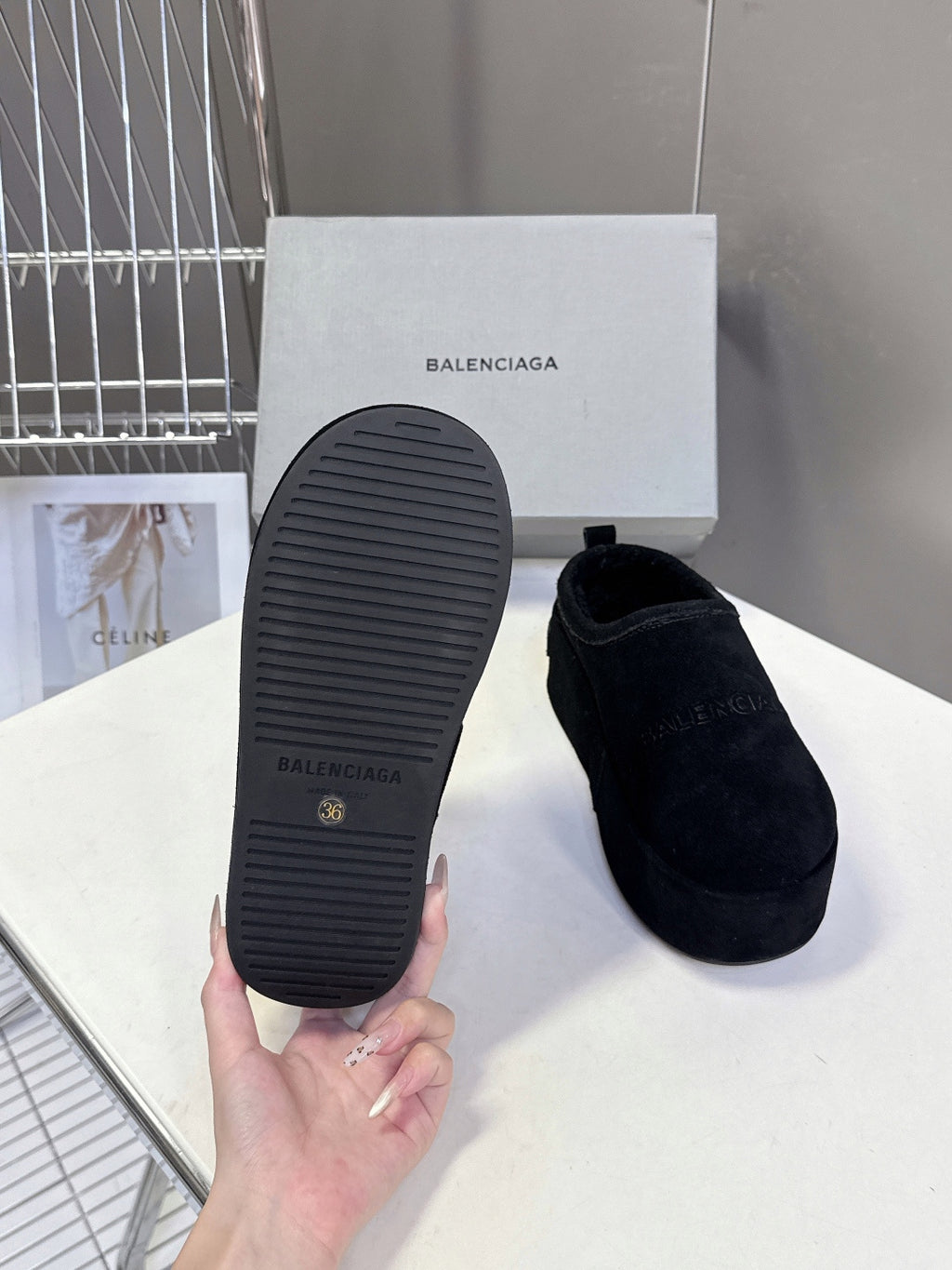 Balenciaga black suede slip-on sandals with textured rubber outsole close-up