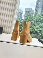 Chanel tan suede ankle boots with chain trim, side pull tabs, logo detail