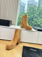 Chanel tan suede ankle boots with block heel, chain-trimmed seams