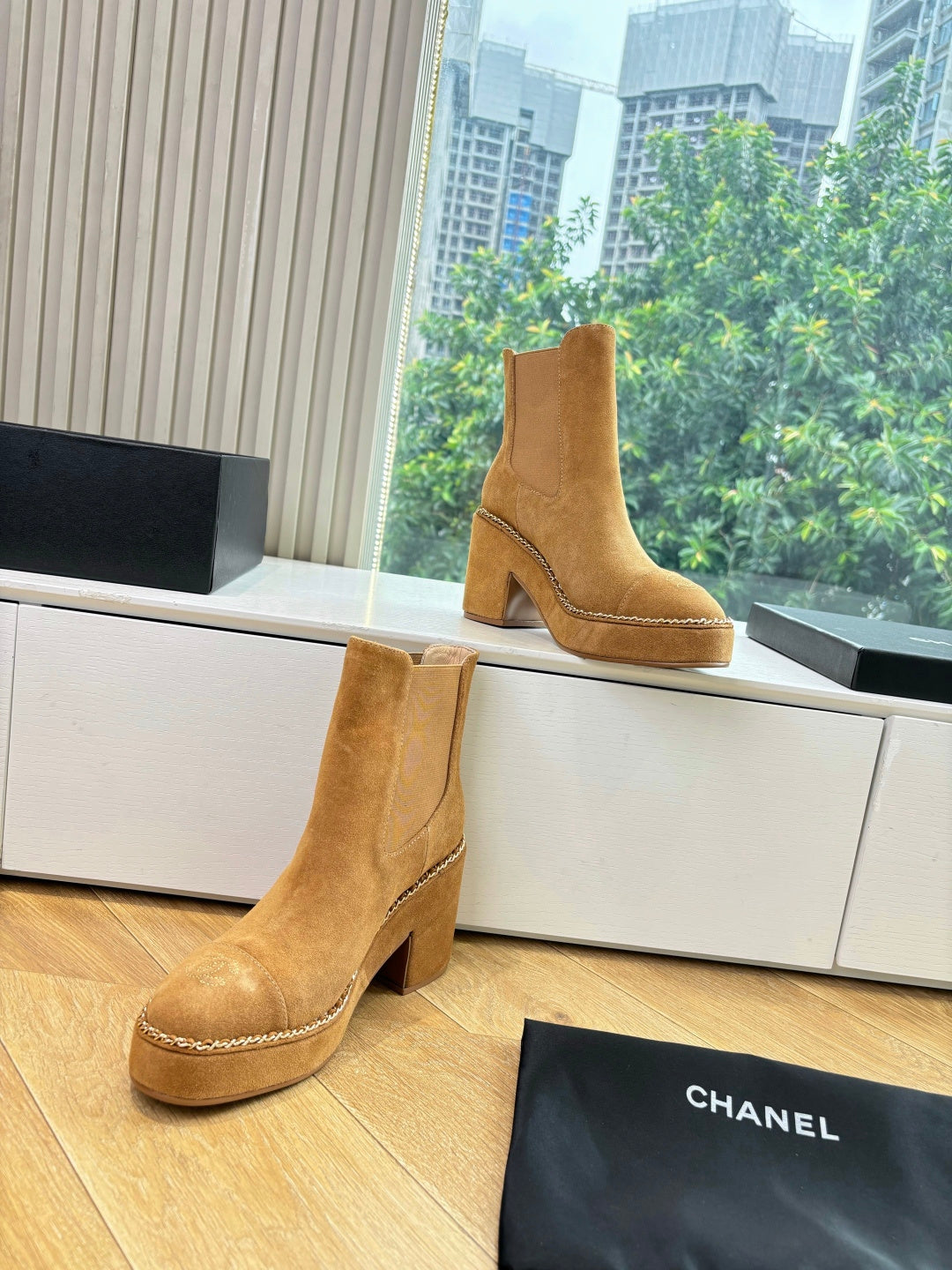 Chanel tan suede ankle boots with block heel, chain-trimmed seams