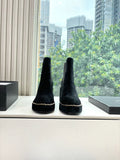 Pair of black suede ankle boots with chunky heel and contrast chain-stitch trim