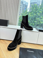 Black suede ankle boots with chunky heel and chain-stitch trim