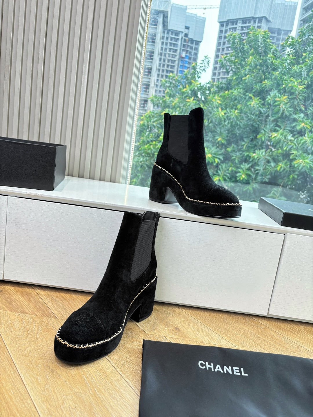 Black suede ankle boots with chunky heel and chain-stitch trim