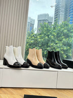 Women’s Chelsea ankle boots in white, tan, and black with block heels