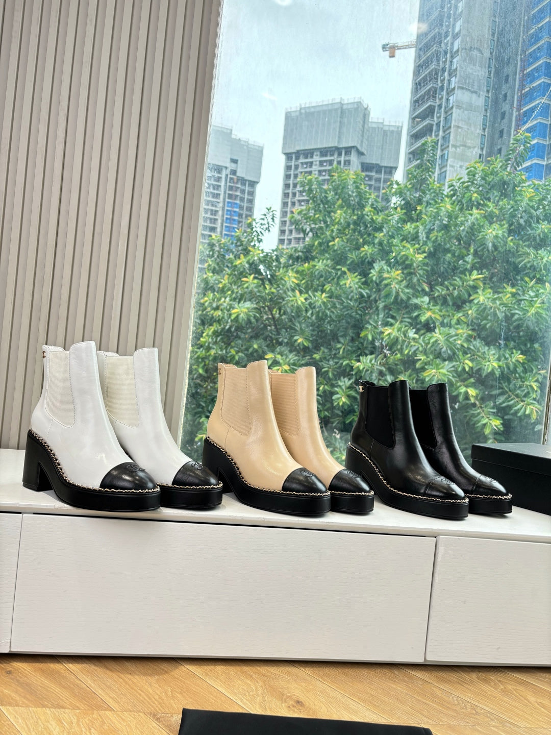Women’s Chelsea ankle boots in white, tan, and black with block heels