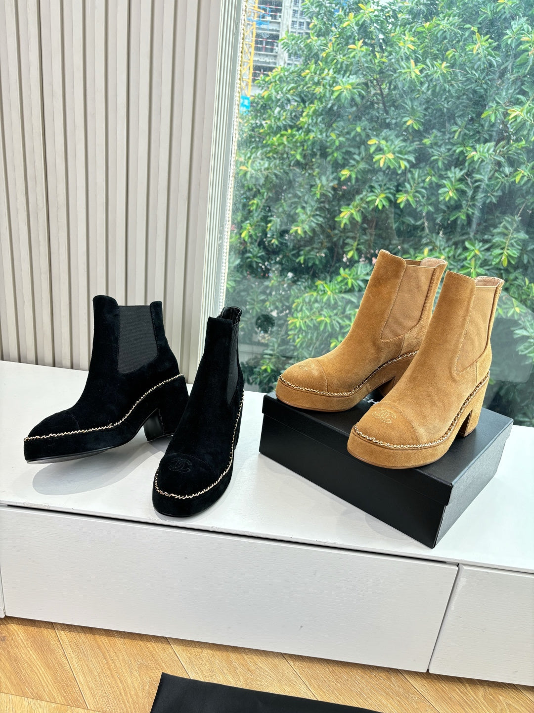Women’s Chelsea ankle boots in black and tan with block heels and elastic sides