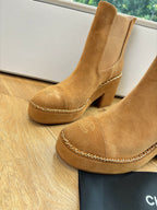 Chanel tan suede ankle boots close-up: chain-trimmed vamp and block heel