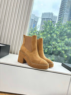 Chanel suede ankle boots with wide block heel, tan pull-on style, chain edging