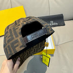 Fendi monogram cap in brown and tan with interior band and curved brim