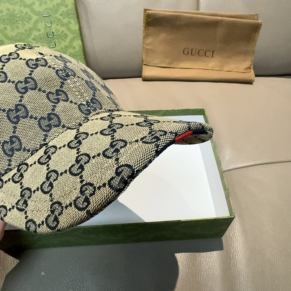 Gucci GG-pattern baseball cap side view with curved brim and red navy stripe