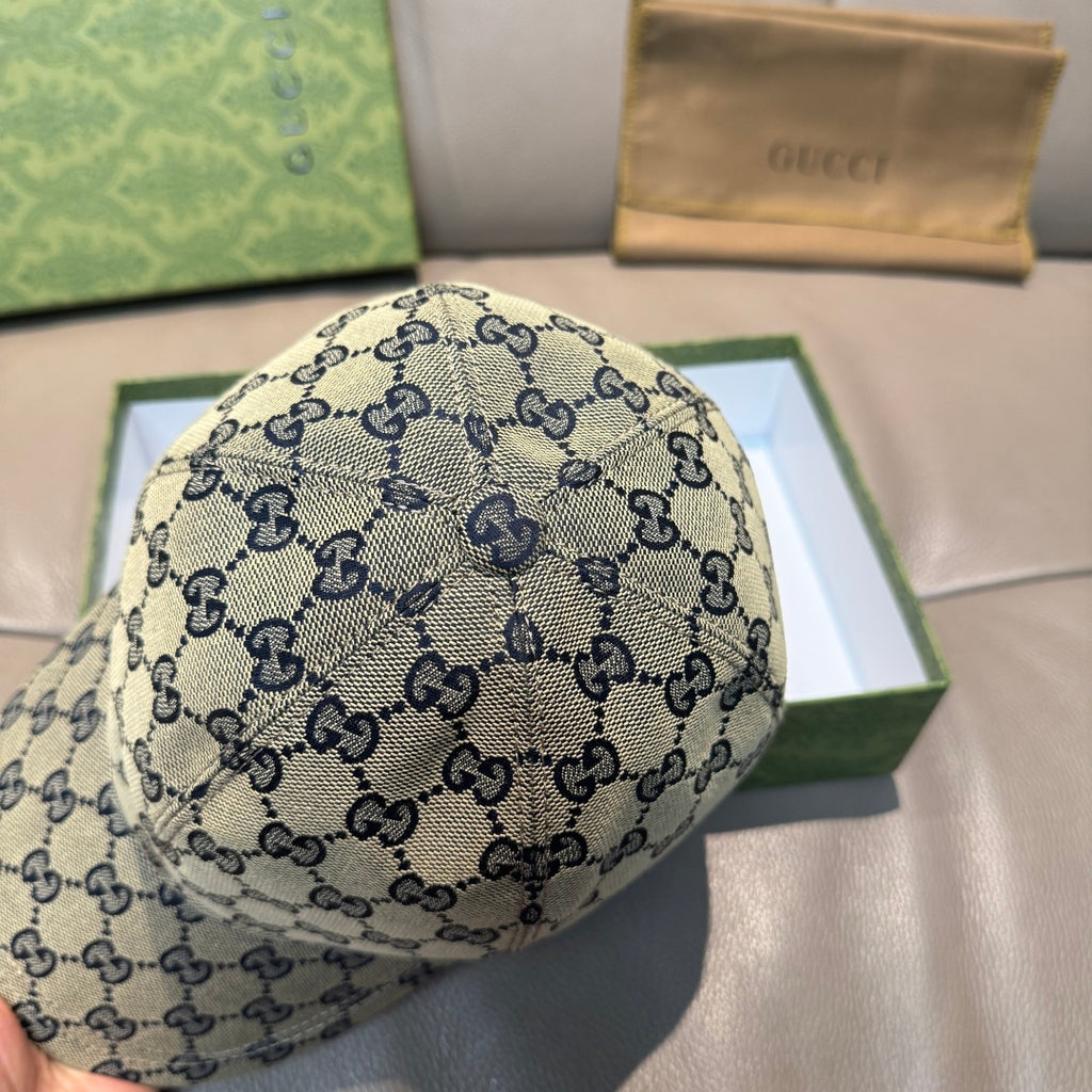 Gucci GG logo baseball cap, light background with navy allover pattern