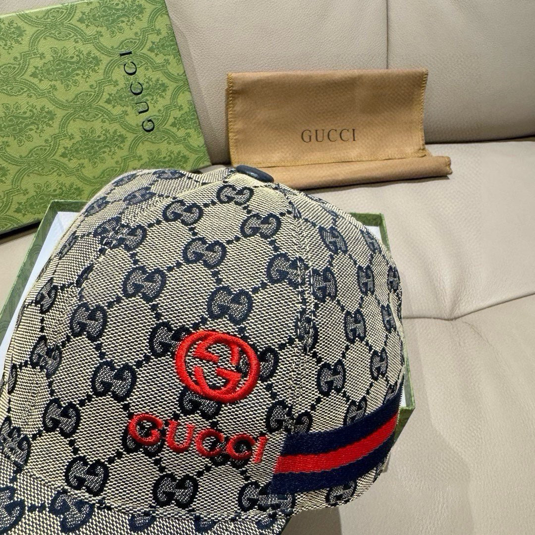 Gucci cap close-up with red GG emblem and navy and red web stripe