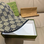 Gucci cap brim close-up with blue GG pattern and dark fabric edge