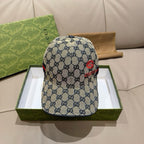 Gucci cap with blue GG pattern and red emblem on the front panel