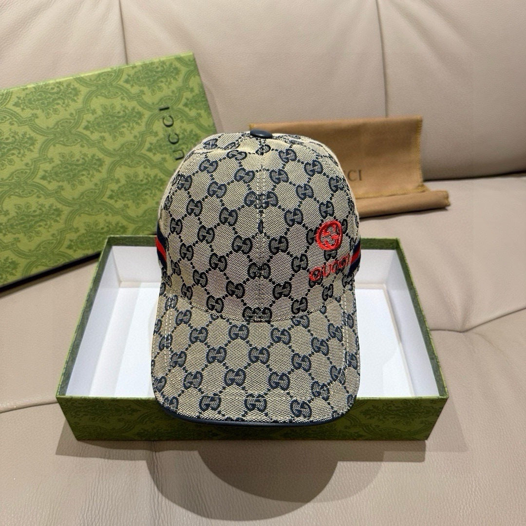 Gucci cap with blue GG pattern and red emblem on the front panel