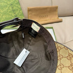 Gucci cap interior view with black lining and brown monogram headband