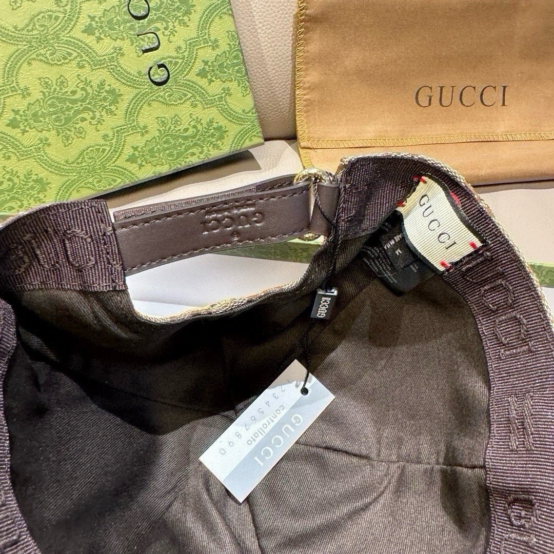 Gucci cap interior with brown monogram band and hanging Gucci size tag