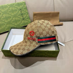 Gucci cap in beige GG canvas with red logo at front and multicolor web stripe