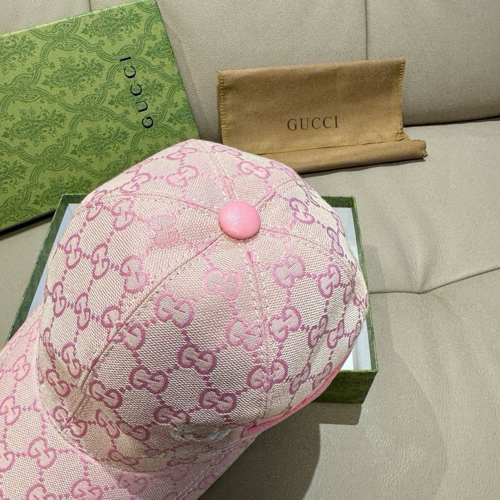 Gucci pink cap top with dome button and allover GG logo pattern