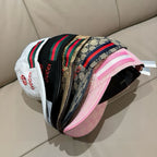 Assorted Gucci monogram caps with multicolor stripe bands and GG pattern