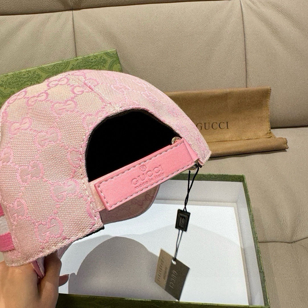 Gucci pink baseball cap with black interior and adjustable strap closure