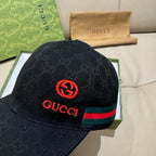 Black Gucci GG baseball cap close-up with red Interlocking G and green red stripe