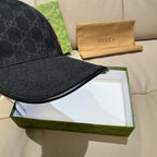 Black Gucci GG baseball cap with curved brim and visible monogram pattern