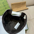 Black interior baseball cap with white strap and Gucci monogram trim detail