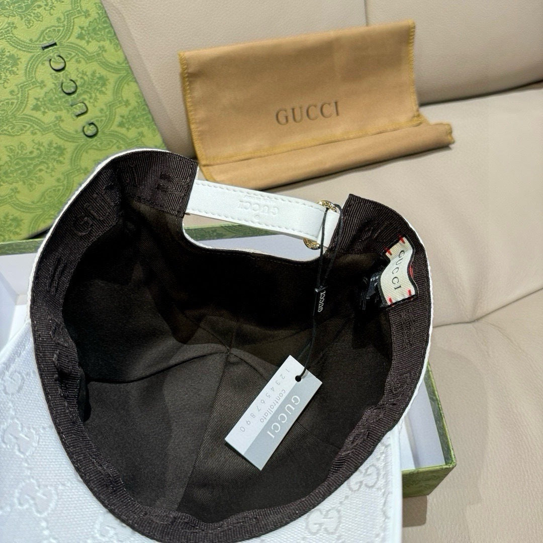 Black interior baseball cap with white strap and Gucci monogram trim detail