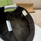 Black-lined baseball cap interior with leather trim and Gucci brand label