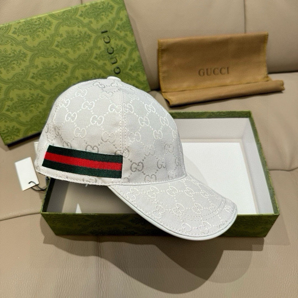 White GG-print baseball cap with black, red, and green striped web band