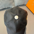 Louis Vuitton cap, dark gray with white snap button at crown