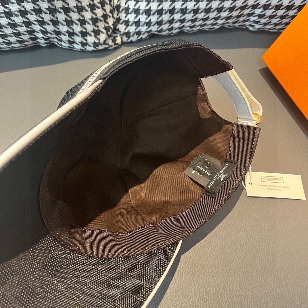 Dark gray baseball cap interior lining with brown strap tag and white label