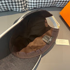 Dark gray baseball cap interior lining with brown strap tag and white label