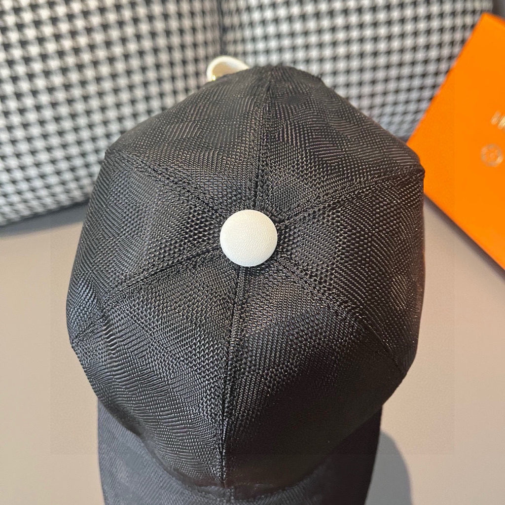 Dark gray baseball cap top with white button, textured pattern, seam detailing