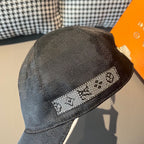 Dark baseball cap with textured fabric and checkered patterned logo band