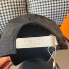 Dark baseball cap with Louis Vuitton label and “Made in Paris” tag