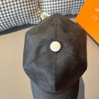 Dark baseball cap with curved brim and round white top button