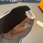 Dark baseball cap interior with tan lining and adjustable strap