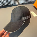 Dark baseball cap with geometric patterned band along the brim