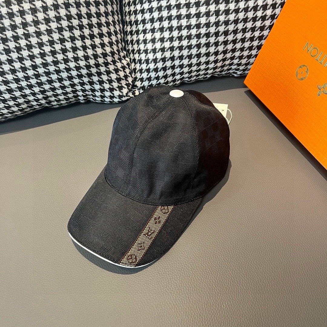 Louis Vuitton dark cap with white top button and patterned front panel.