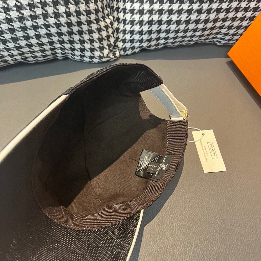 Louis Vuitton dark cap interior with brown trim and size tag.