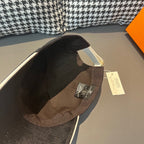 Louis Vuitton dark cap interior with brown trim and size tag.