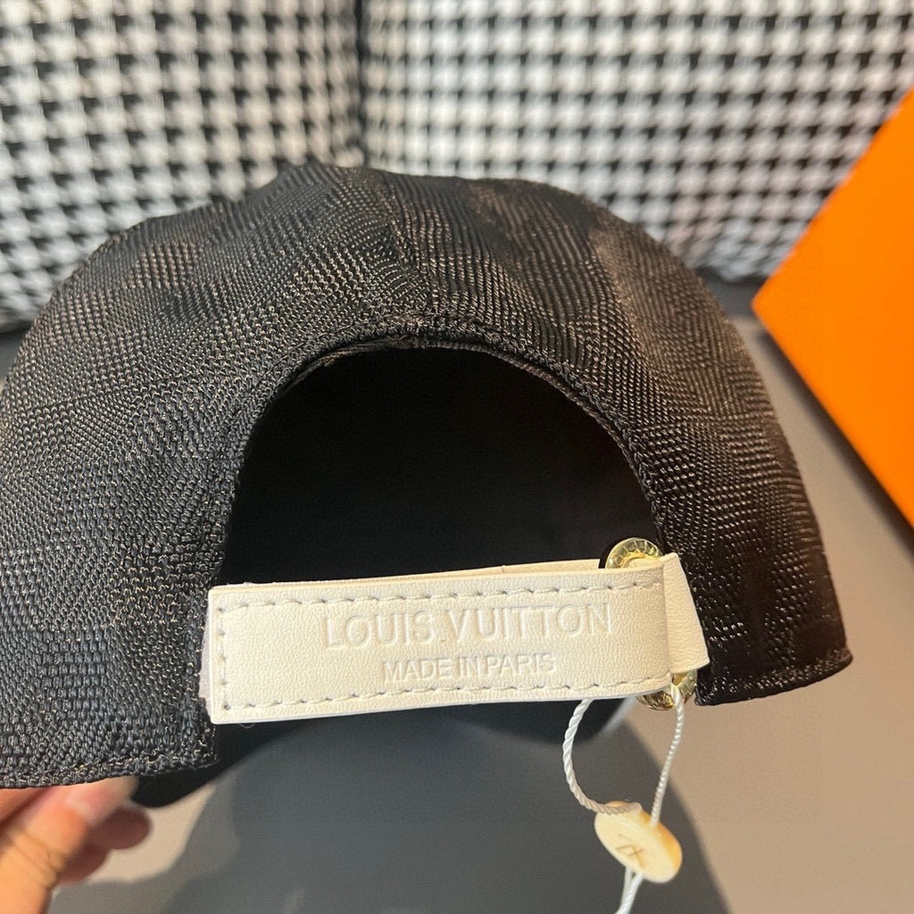 Louis Vuitton cap inner strap with “LOUIS VUITTON” patch and pull tag.