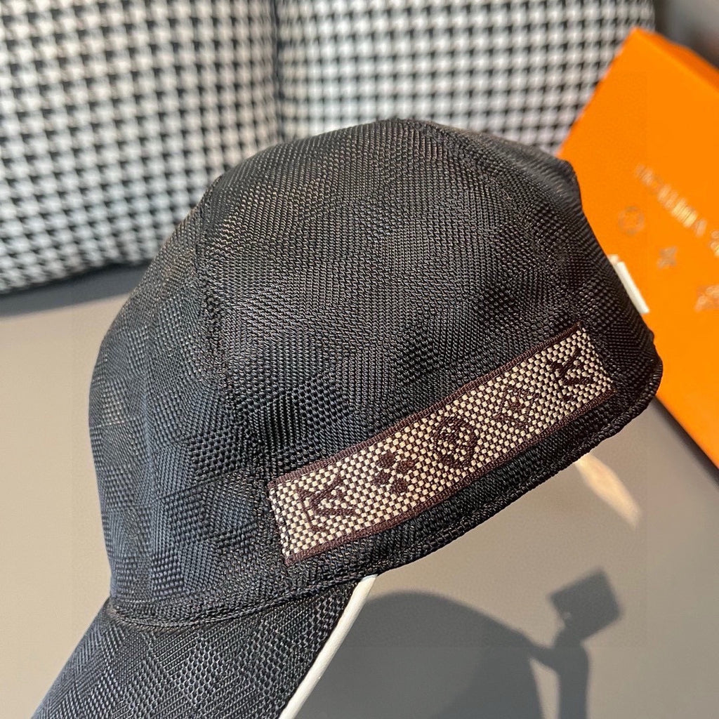 Baseball cap front view, dark textured fabric with patterned band detail