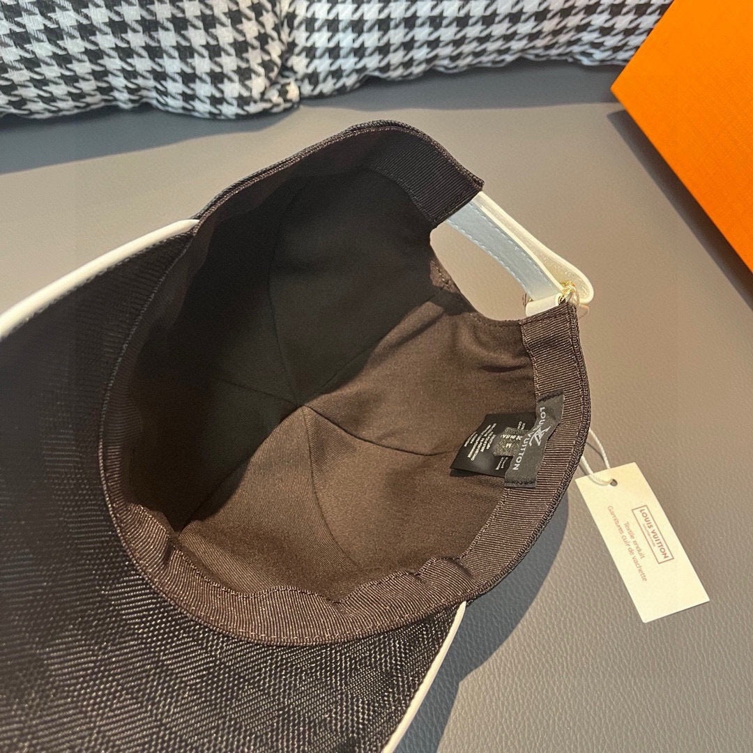Baseball cap interior, dark lining, adjustable strap and tag