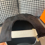 Baseball cap interior label, stitched tag reading LOUIS VUITTON MADE IN PARIS