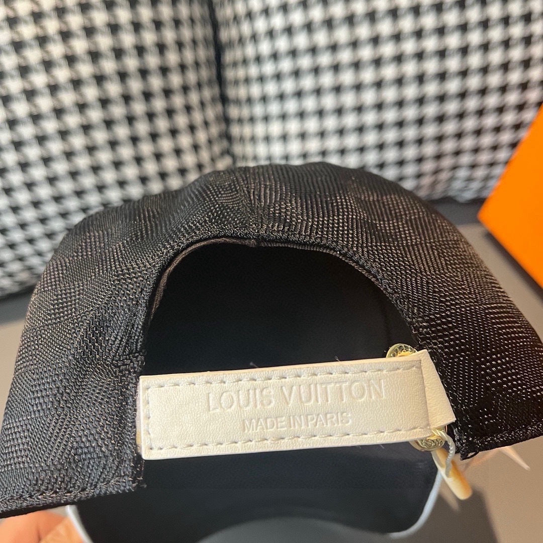 Baseball cap interior label, stitched tag reading LOUIS VUITTON MADE IN PARIS